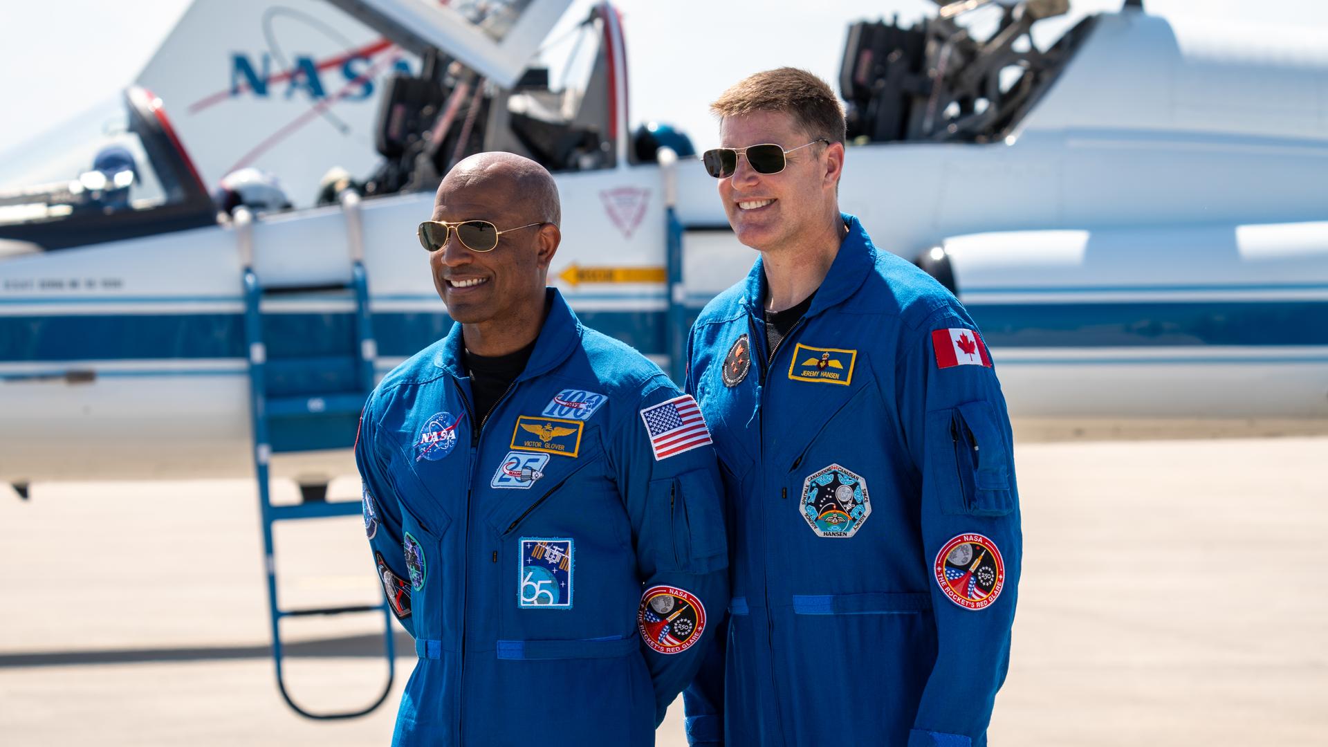 DESCRIPTION:  These images show the moments shortly after the arrival of the Artemis II crew to NASA’s Kennedy Space Center on March 27, 2026 ahead of the launch. The four astronauts, Victor Glover, Reid Wiseman, Christina Koch, and Jeremy Hansen, arrived on a T38, which can be seen behind them. They took turns speaking to the crowd as they also announced the zero-gravity indicator they would be taking with them on their journey. 